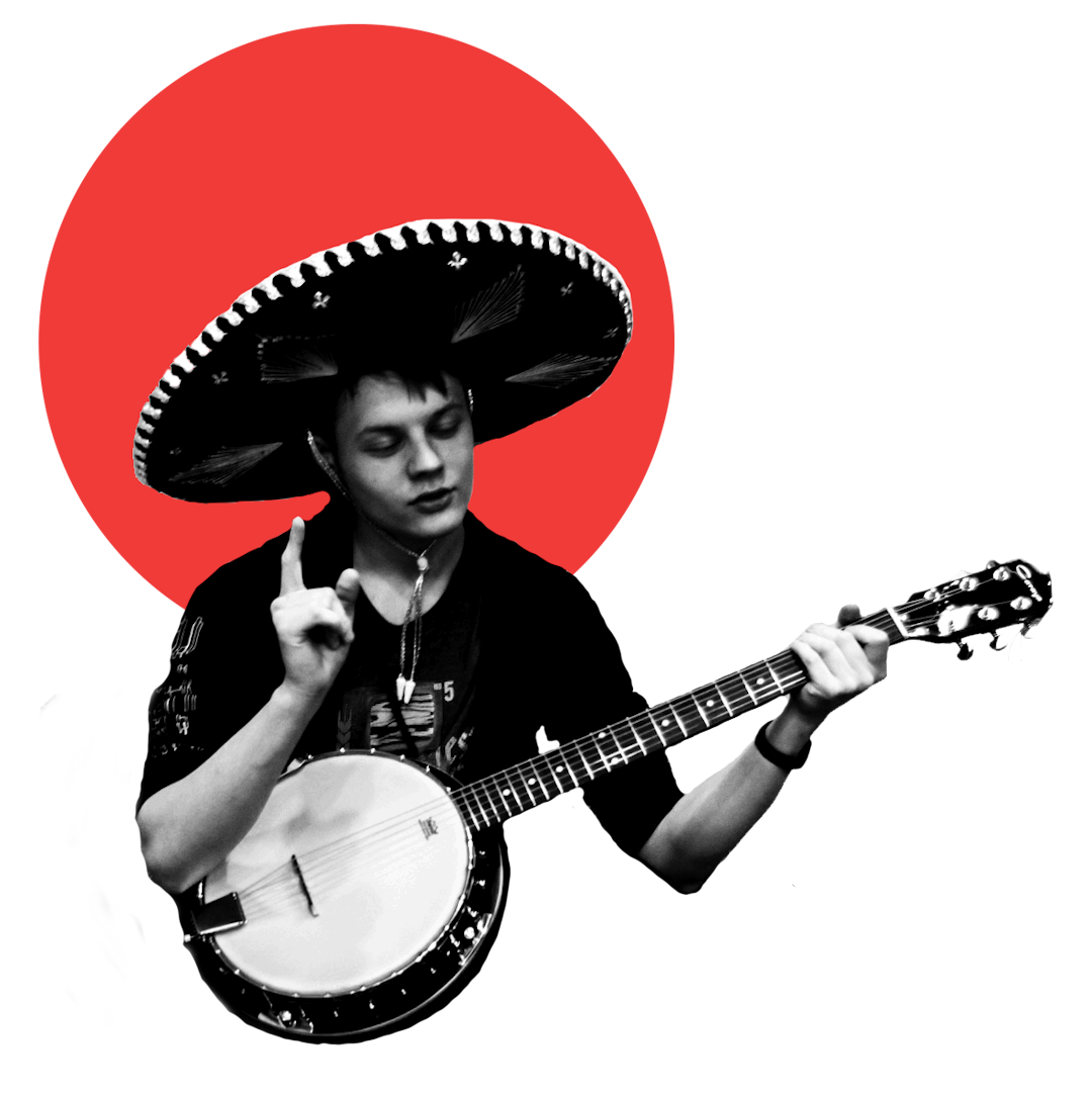 Александр Сидоренко в мексиканской шляпе и с банджо в руках